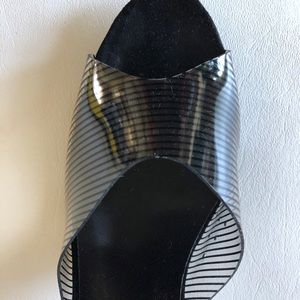 Show off your pretty pedi in this stripped clear sandal!